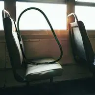 Bus seat with sneeze guard